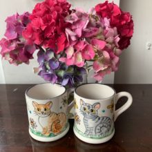 Pair of hand painted cat mugs