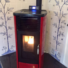 Blue and white tile mural behind stove