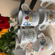 collection of hand painted mugs
