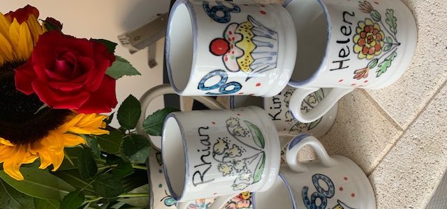 collection of hand painted mugs
