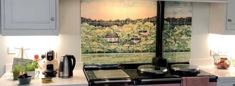 Green wood tile mural behind Aga range cooker in kitchen