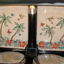 Hawaiian inspired kitchen tile mural behind aga range cooker