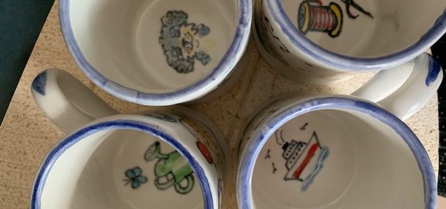 paintings inside mugs