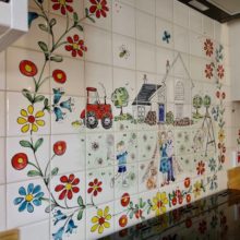 Kitchen splashback red tractor tile mural