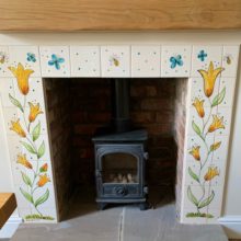 Fireplace with flower tile surround