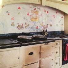 We love cakes tile mural behind Aga range cooker