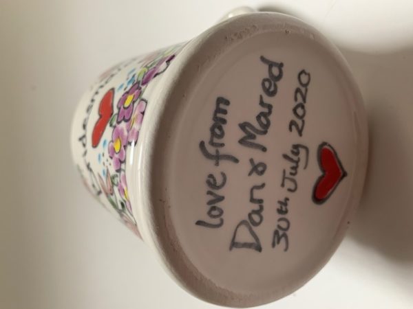 Hand painted personalised message on bottom of mug